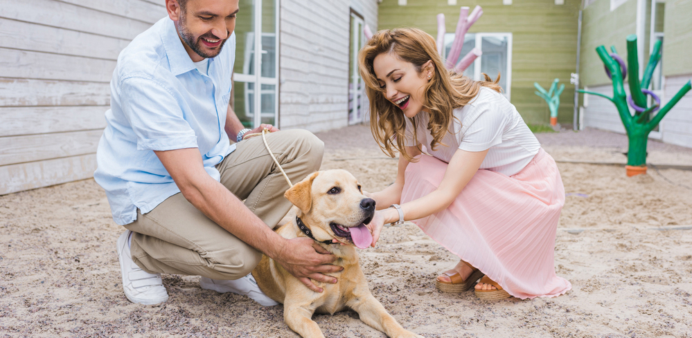 People with dog outside